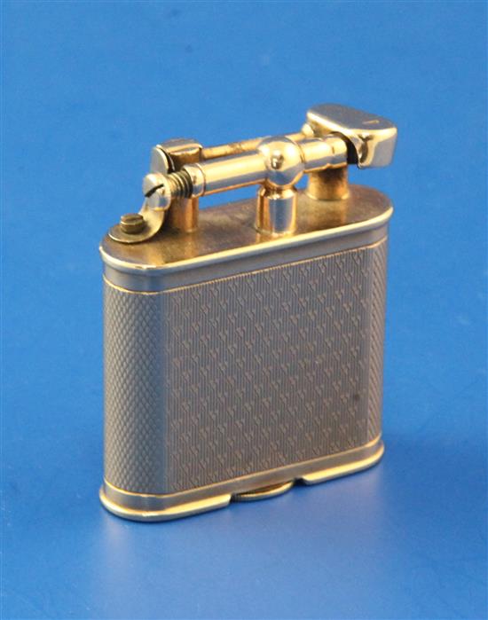 A late 1920s engine turned 9ct gold Dunhill Unique petrol lighter, 1.75in.